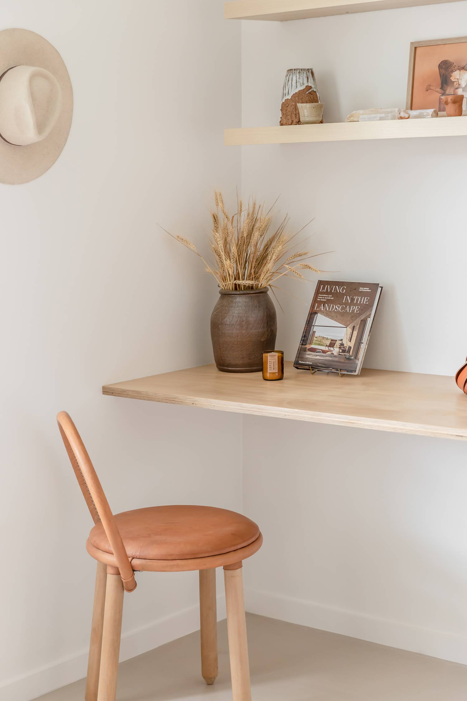 Simple-earthy-study-nook-styled-with-natural-elements-and-a-timber-and-leather-chair