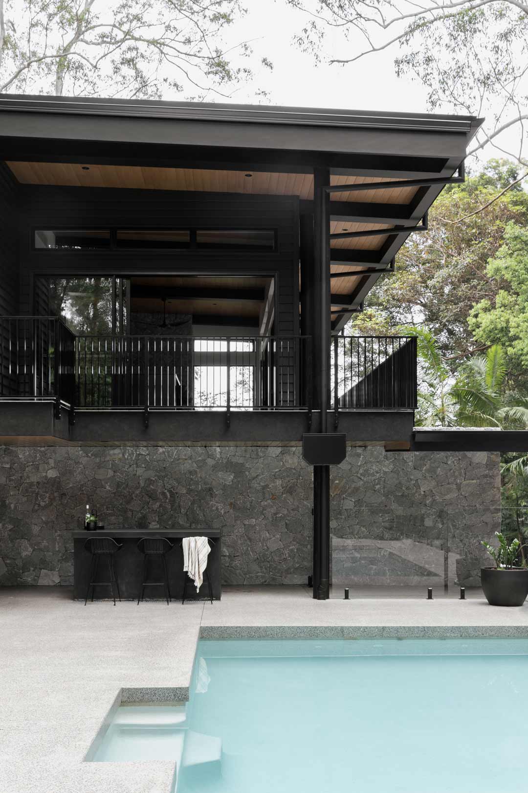 A-monochomatic-alpine-lodge-style-home-with-a-pool-and-pool-bar-for-entertaining