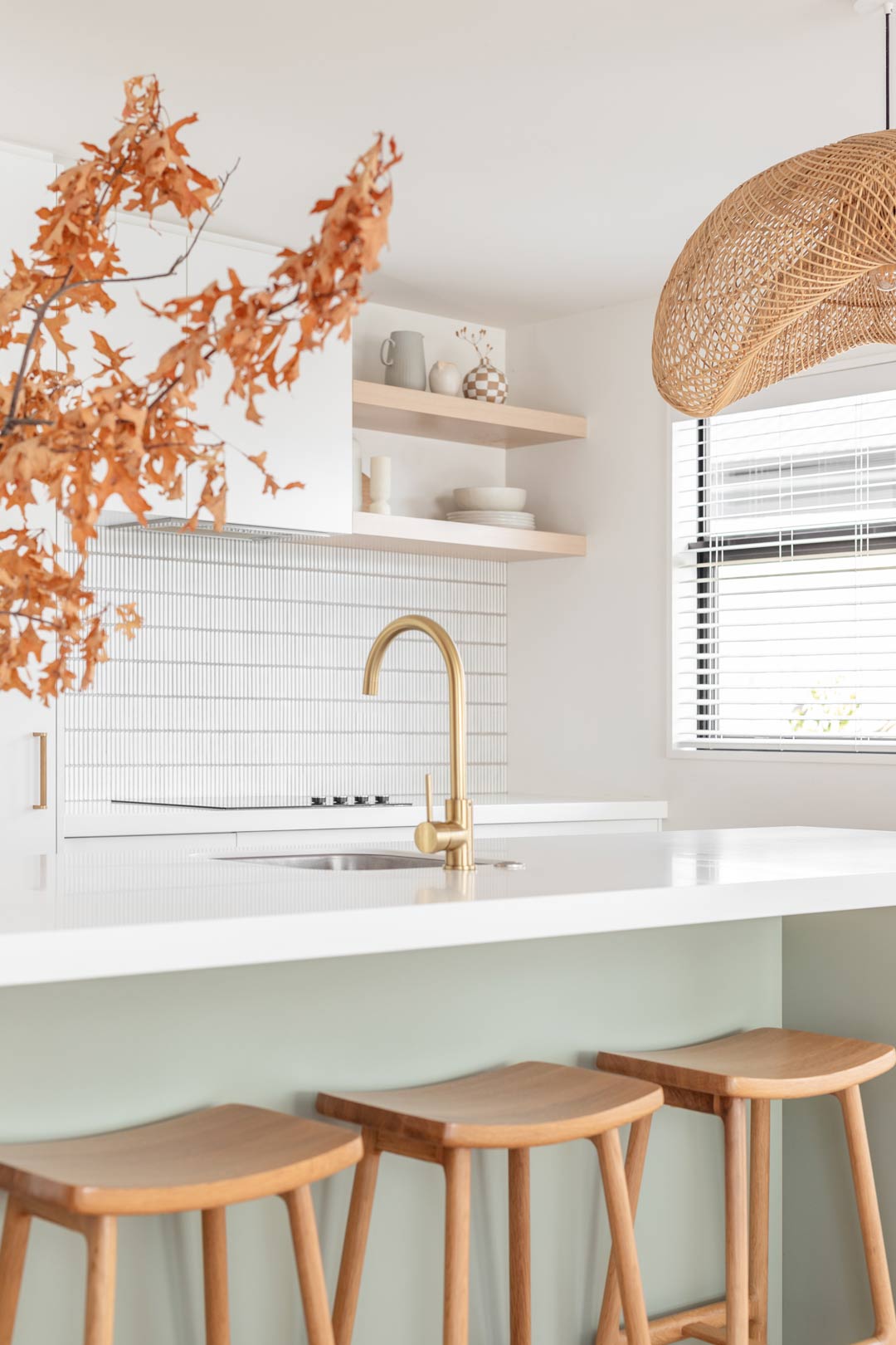 How-much-for-a-kitchen-renovation-when-renovating-to-sell-green-kitchen-with-brushed-brass-tapware-and-white-kit-kat-tiles