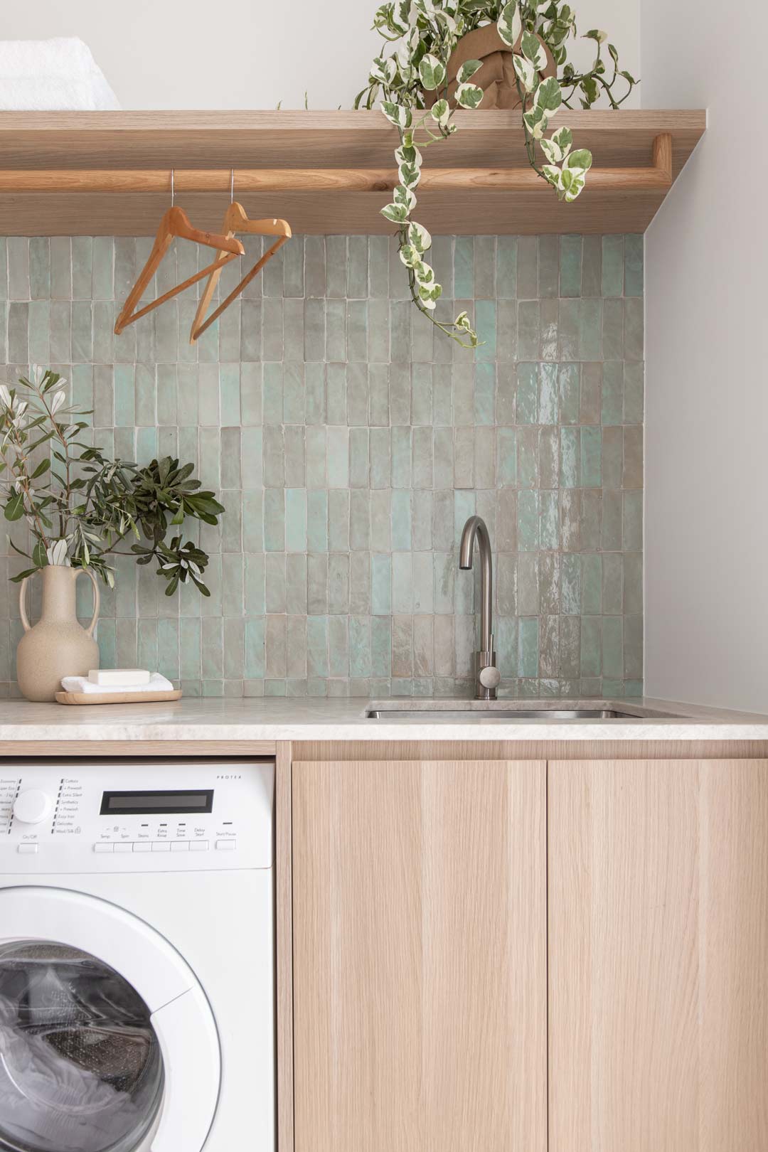 DIY-small-laundry-ideas-creating-a-clean-space-and-adding-storage-with-a-hanging-drying-rail-and-shelves