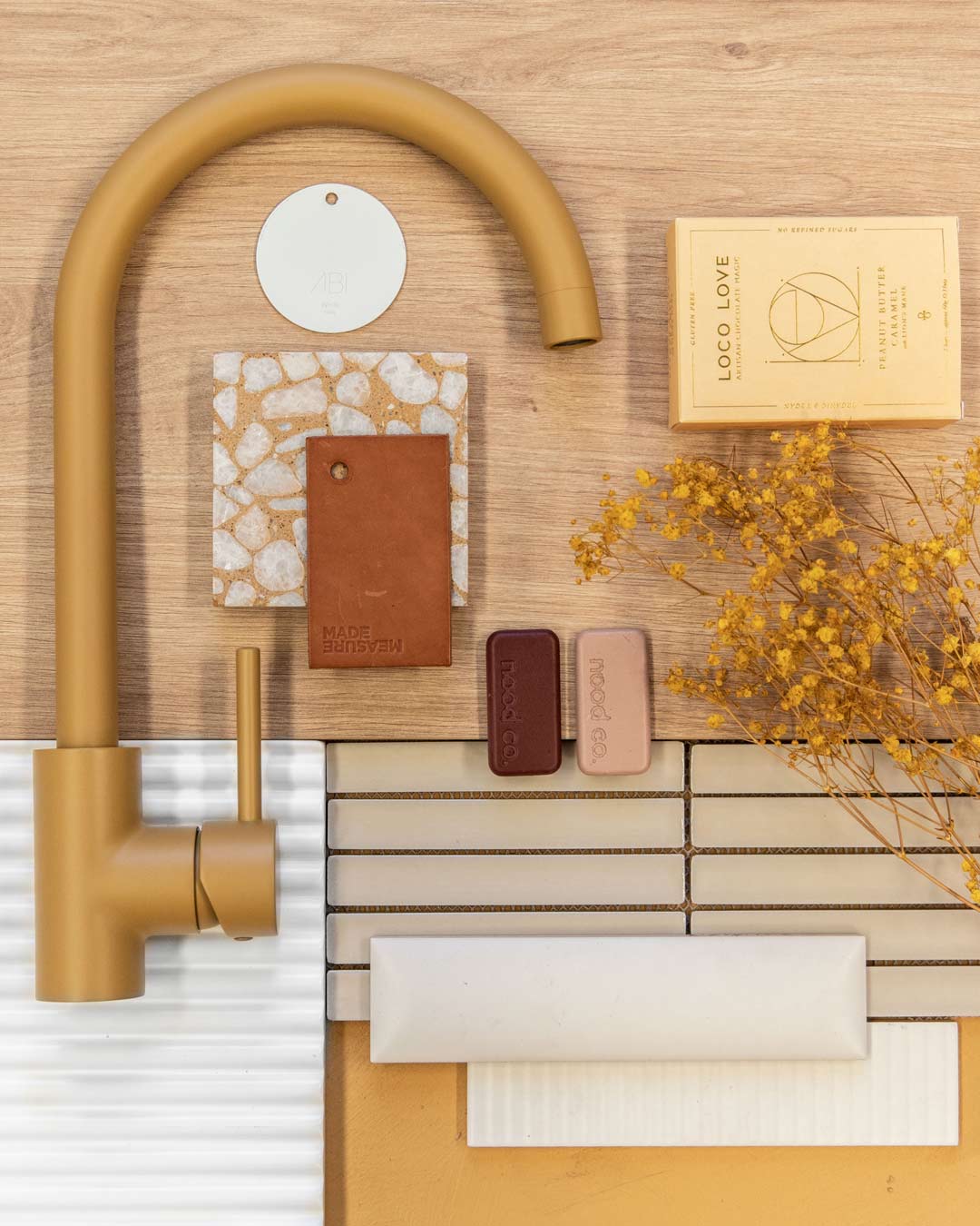 A-yellowmoodboard-introducing-warmth-into-your-bathroom-with-a-golden-yellow-tap-and-terazzo-tiles-