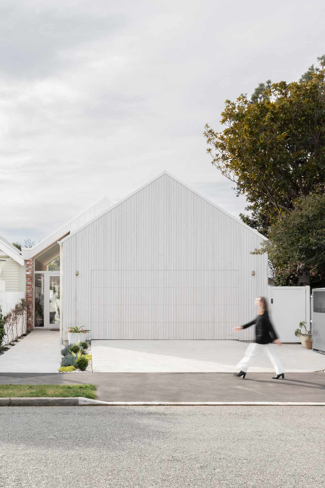 House-tour-of-a-modern-barnhouse-with-white-vertical-panelling-and-a-pitched-roof