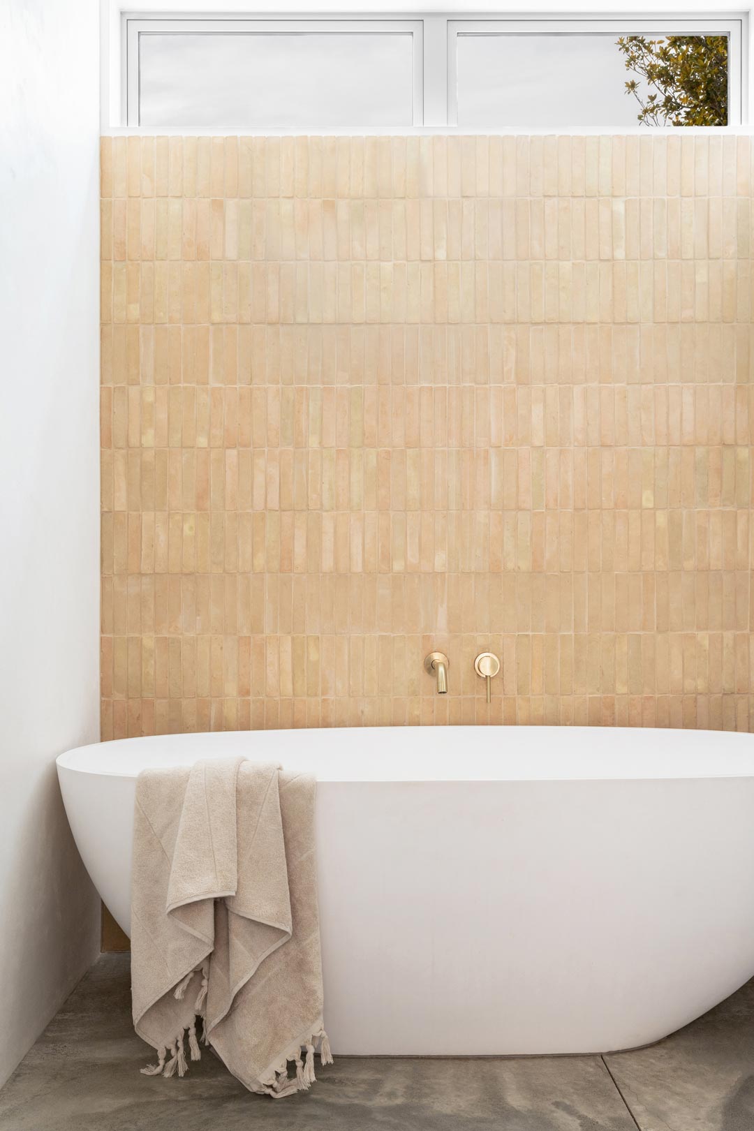 Mediterranean-interior-design-in-a-modern-barnhouse-style-home-with-vertical-clay-look-tiles-and-brushed-brass-tapware