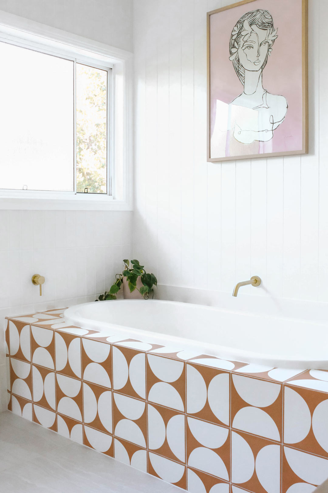 5.-Fitting-a-bath-into-a-small-bathroom-and-building-it-in-with-fun-geometric-feature-tiles