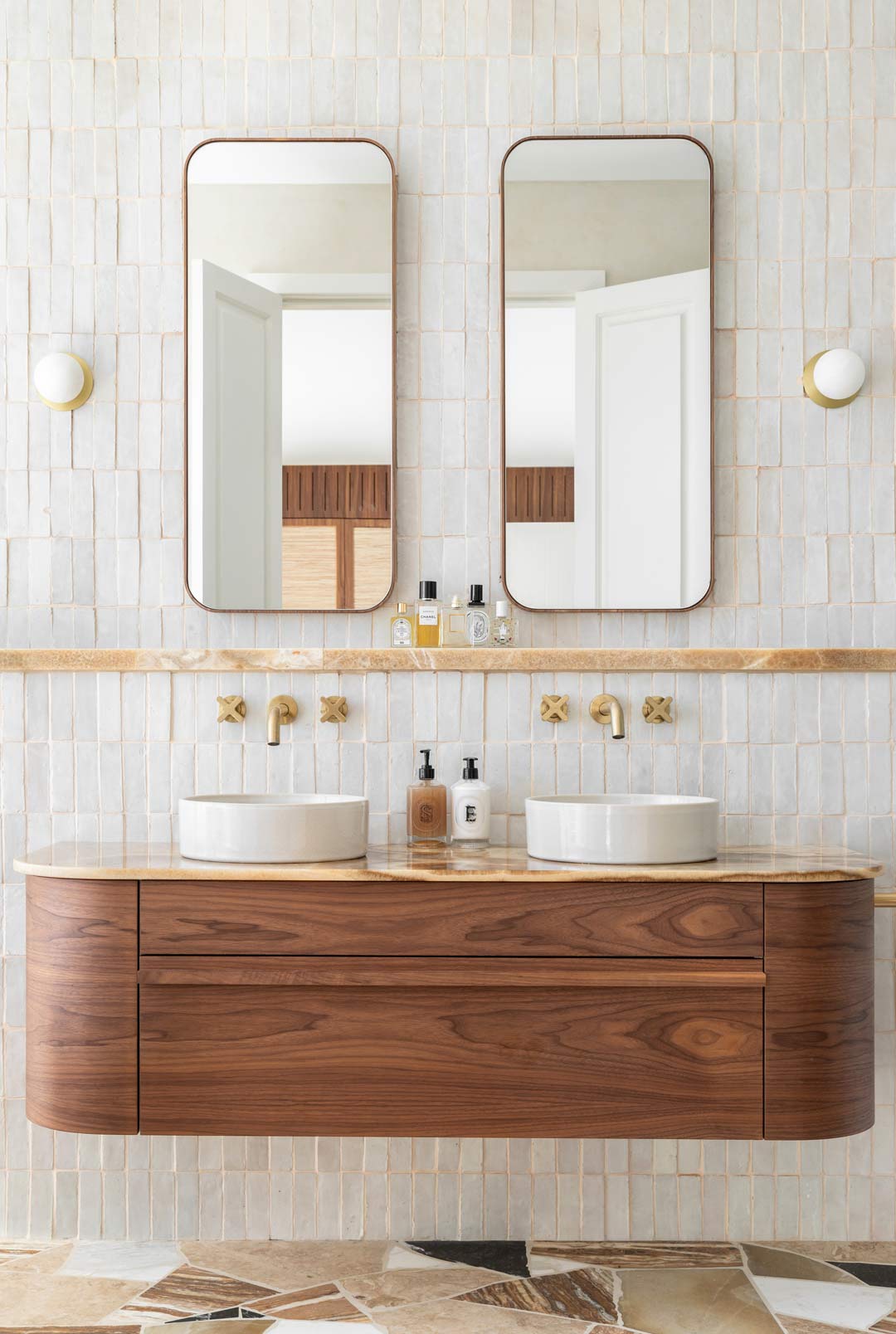 An-art-deco-inspired-bathroom-with-brushed-brass-tapware-light-fixtures-and-walnut-timber-vanity