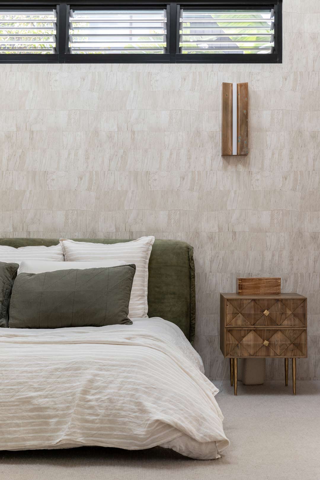 Shelley-Crafts-master-bedroom-with-textured-wallpaper-forest-green-and-pinstripe-bed-linen-and-timber-sidetables