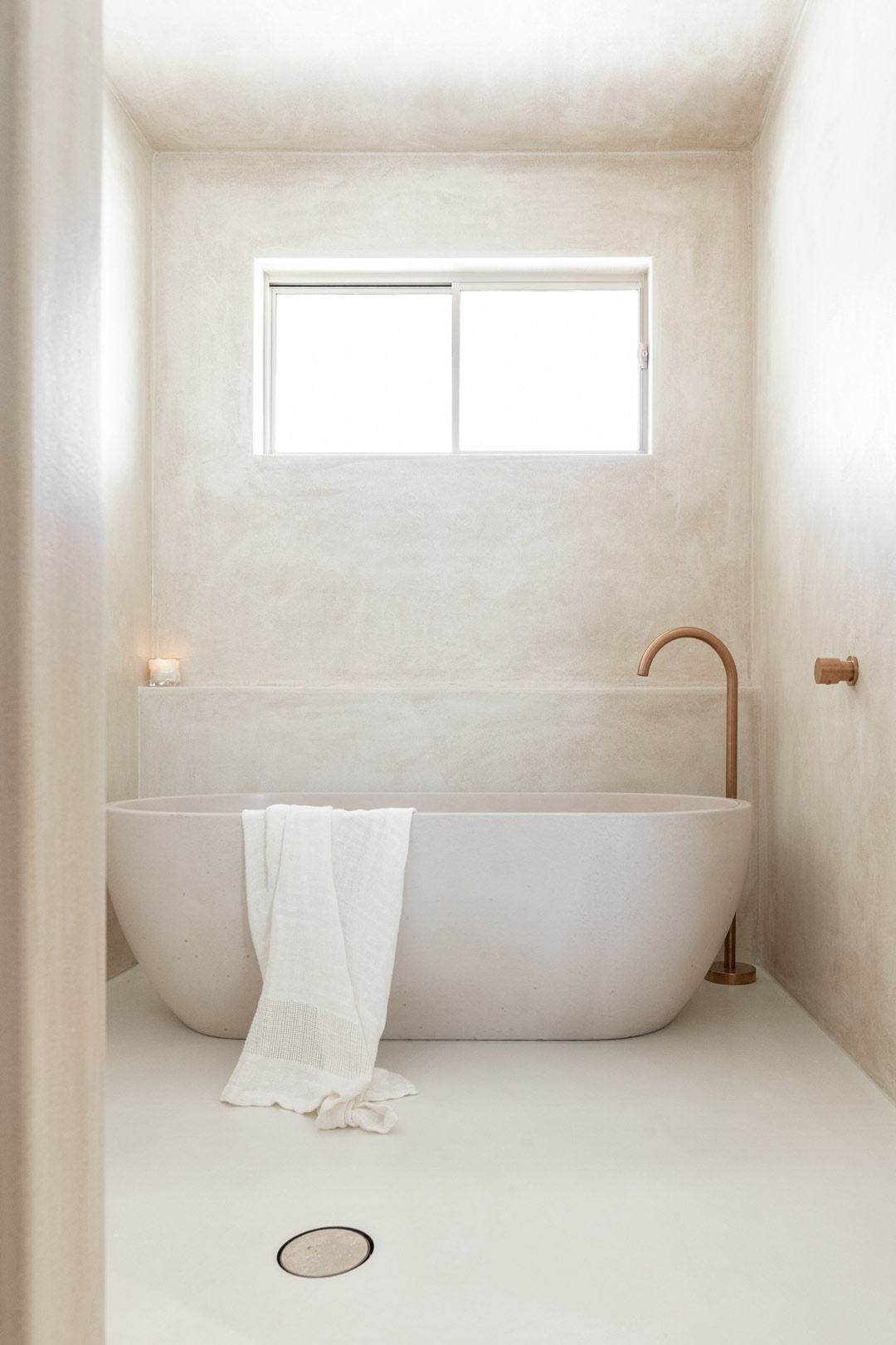 Practice-your-self-care-routine-in-an-ambient-bathroom-with-a-candle-and-no-distraction