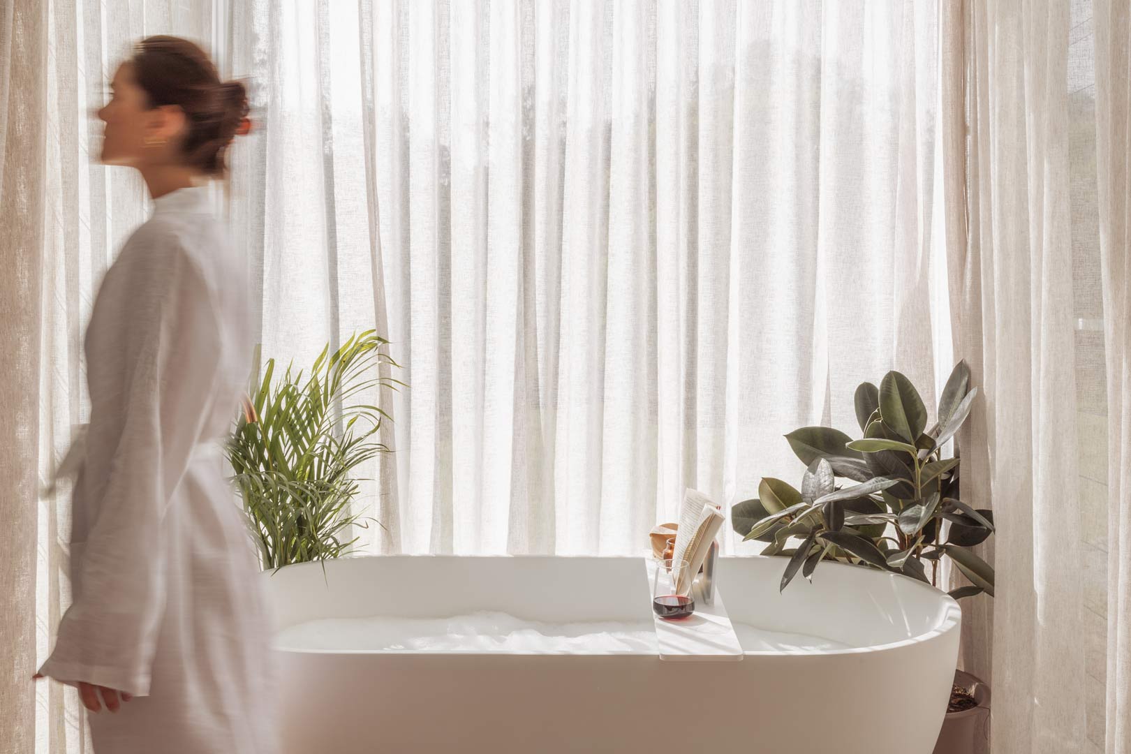 Take-time-for-relaxation-and-take-care-of-yourself-before-bed-with-a-bubble-bath-candle-book-and-glass-of-wine